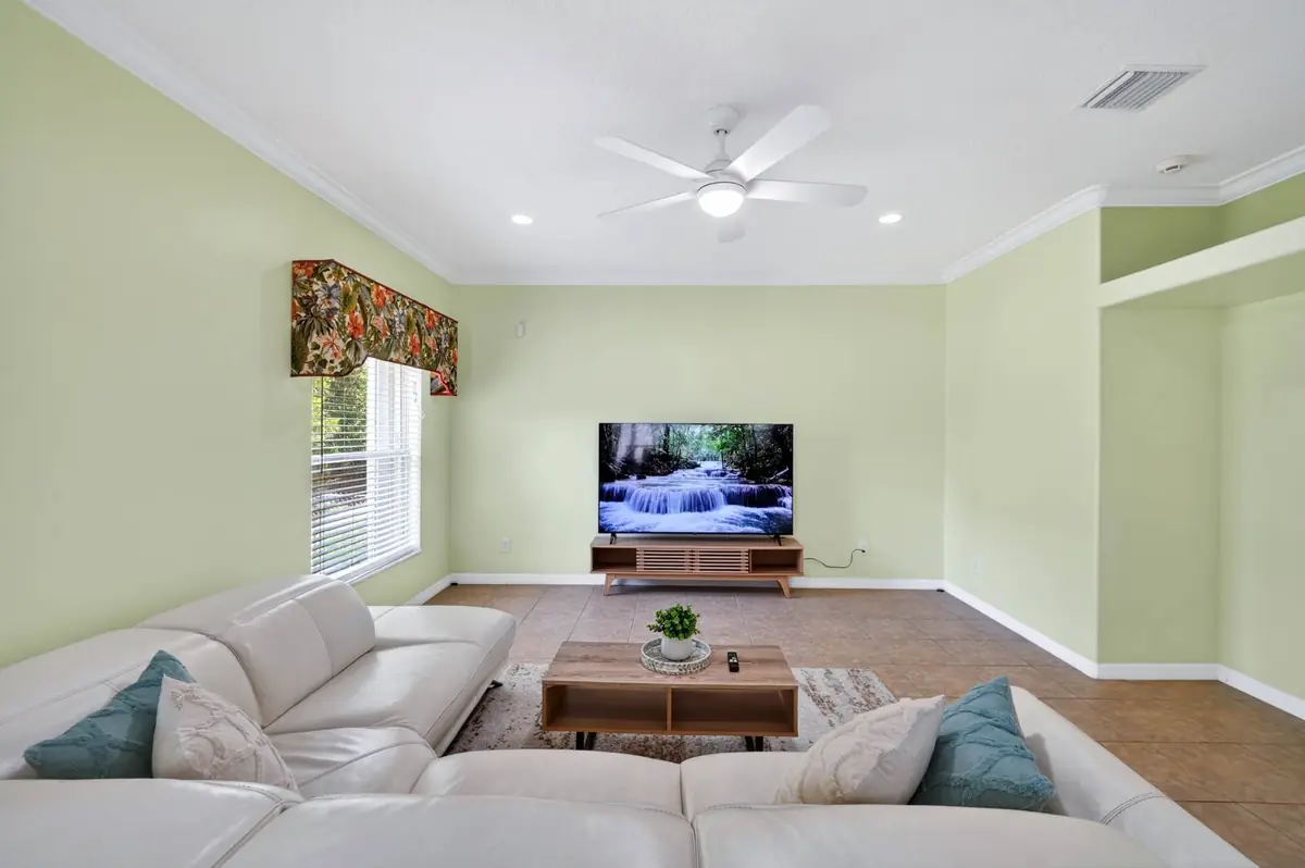 Living room with sectional sofa and wall-mounted TV