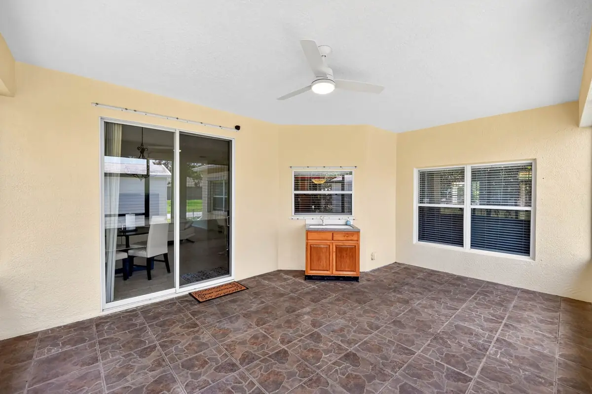 Room with sliding glass doors leading to the patio